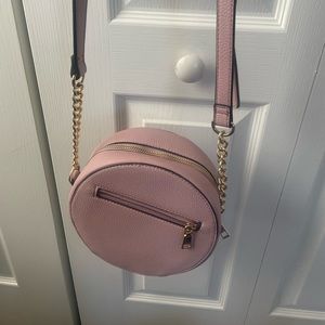 pink circular bag with hints of gold